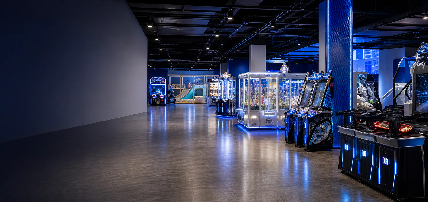 Joypark arcade machines and indoor soft playground equipment in a commercial venue