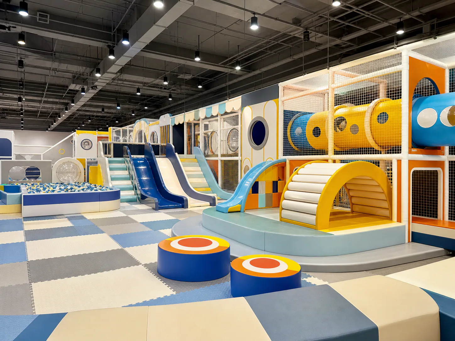 Indoor soft playground project with slides, tunnels, and ball pit
